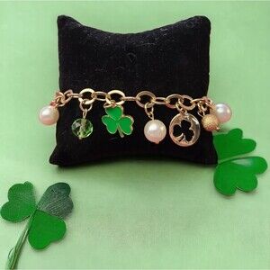 Gold Tone Bracelet with Multiple Irish Charms and Beads in Green, White and Gold